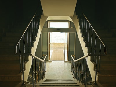 image: Light and water. These stairs, opening from the interior to the exterior, embrace the mesmerizing view of Istanbul and the calm waters of the Bosphorus. The elegant architecture of an old building feels like the beginning of a journey towards the infinity of the sea.