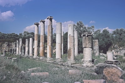 image: Ruins of ancient greek columns stand proud.